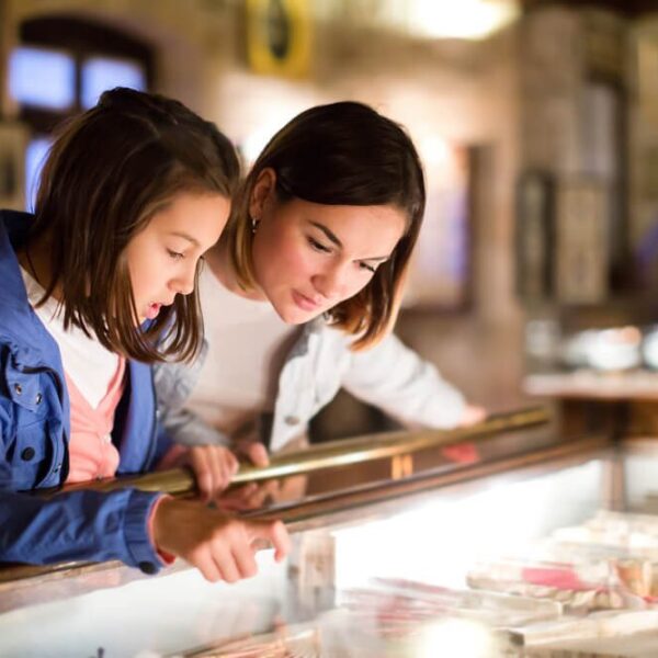 Two people looking at a display case in one of the museums found near Gatlinburg.