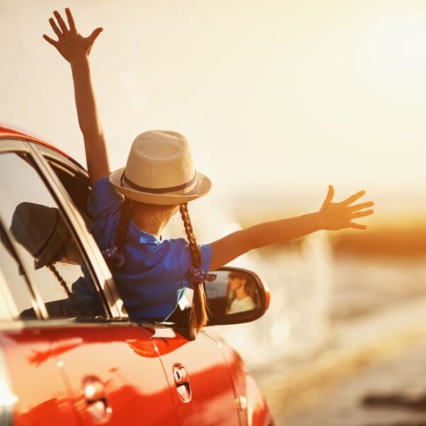 A photo of a young girl enjoying a family road trip from Knoxville to Gatlinburg.