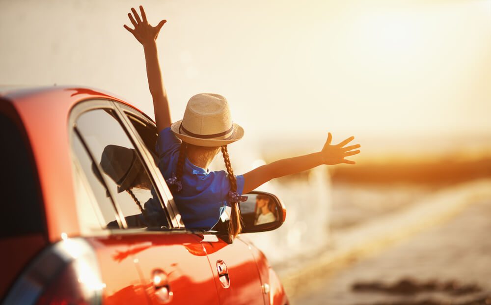 A photo of a young girl enjoying a family road trip from Knoxville to Gatlinburg.