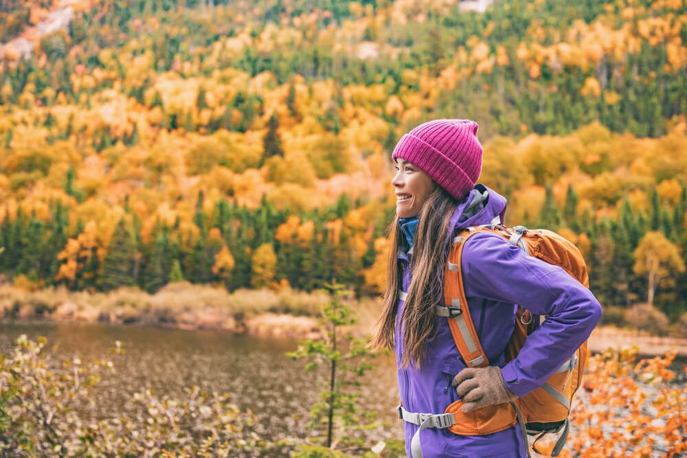 A woman hiking during fall in Tennessee.