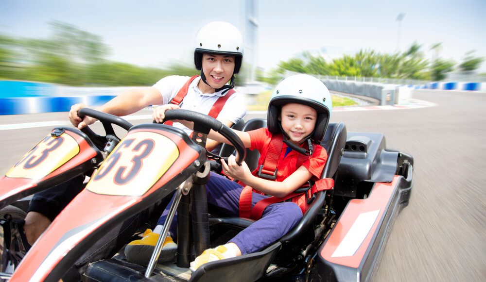 Two people racing on go-karts near Gatlinburg.