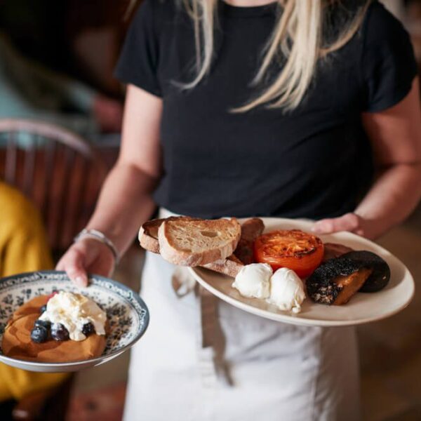 A waitress serving breakfast in a Gatlinburg restaurant.