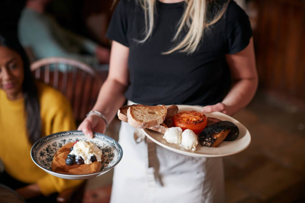 A waitress serving breakfast in a Gatlinburg restaurant.