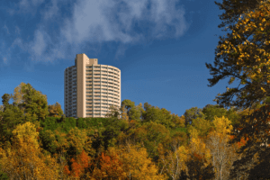 The view of a Gatlinburg hotel surrounded by colorful Tennessee fall foliage.