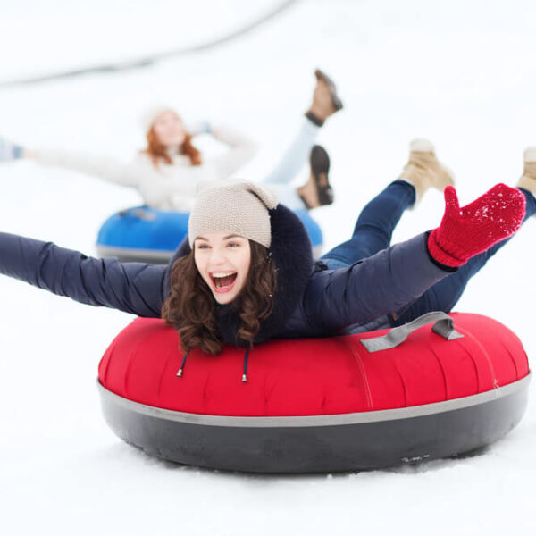 A group of people snow tubing at Ober Mountain.