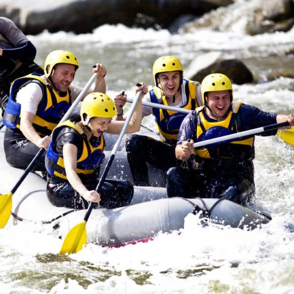 People whitewater rafting on a Tennessee river near Gatlinburg.