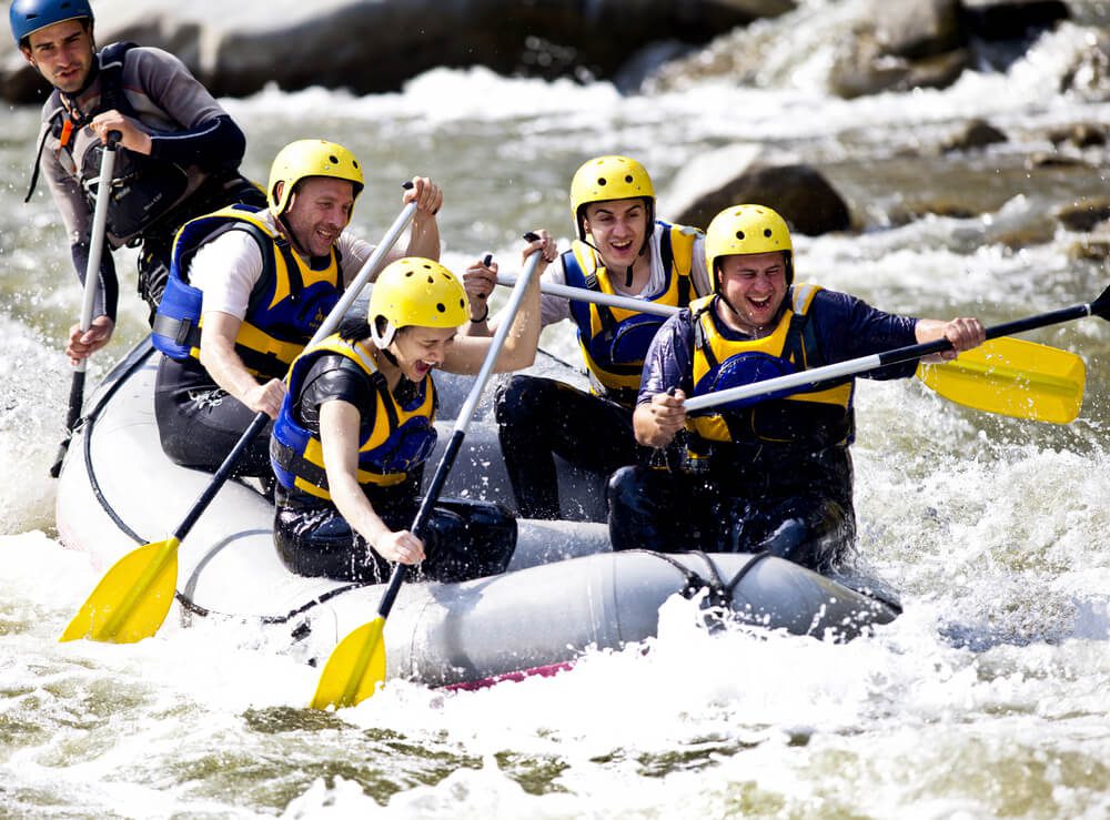 People whitewater rafting on a Tennessee river near Gatlinburg.
