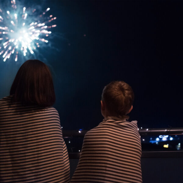 Two people watching fireworks during the Gatlinburg 4th of July celebration.