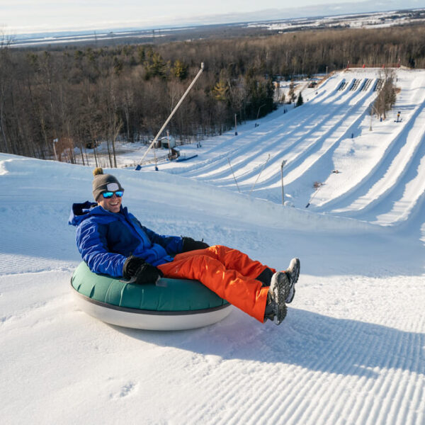 A person snowtubing on a Gatlinburg, TN, winter vacation.